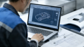 Engineer performing automotive CAD digital modeling for precise body panel design.