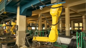 Robotic arm maintaining and processing large-scale tooling molds in the AutoElem factory.
